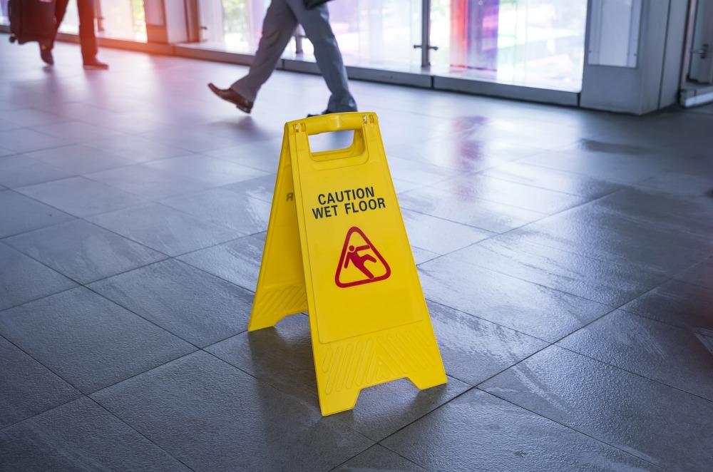 Injured person slipping on wet store floor